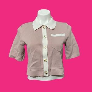 Maje cropped top with styled makeup buttons.